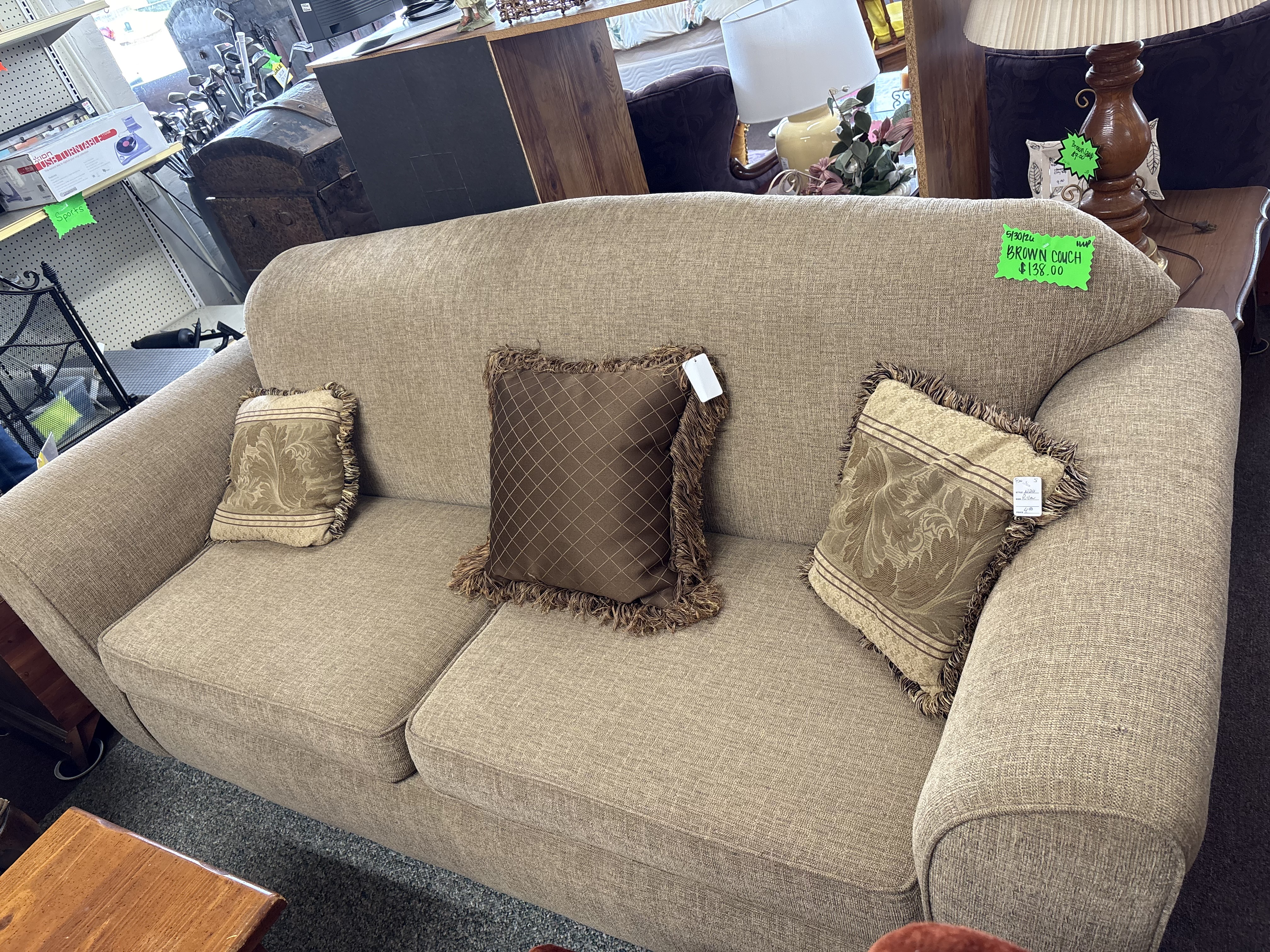 Brown couch with decorative pillows